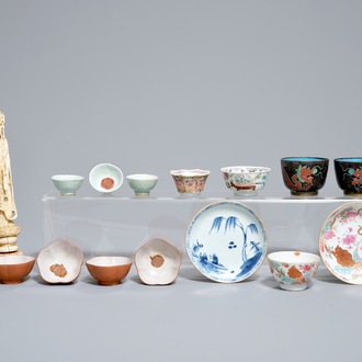 A varied group of Chinese cups and saucers and an ivory figure, Yongzheng and later